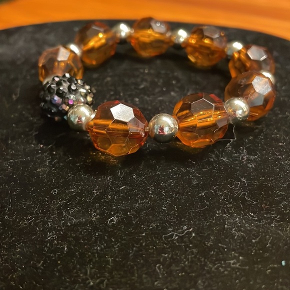 8” stackable stretch bracelet with 8 amber color & 9 silver tone beads - Picture 7 of 13